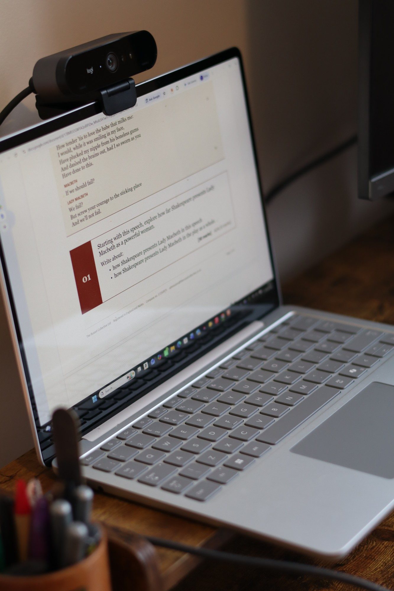 A laptop with a webcam set up for a one-to-one session